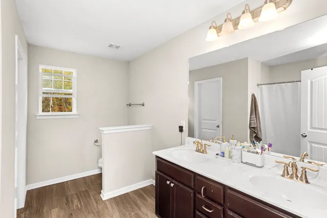 a bathroom with a sink double vanity and a mirror