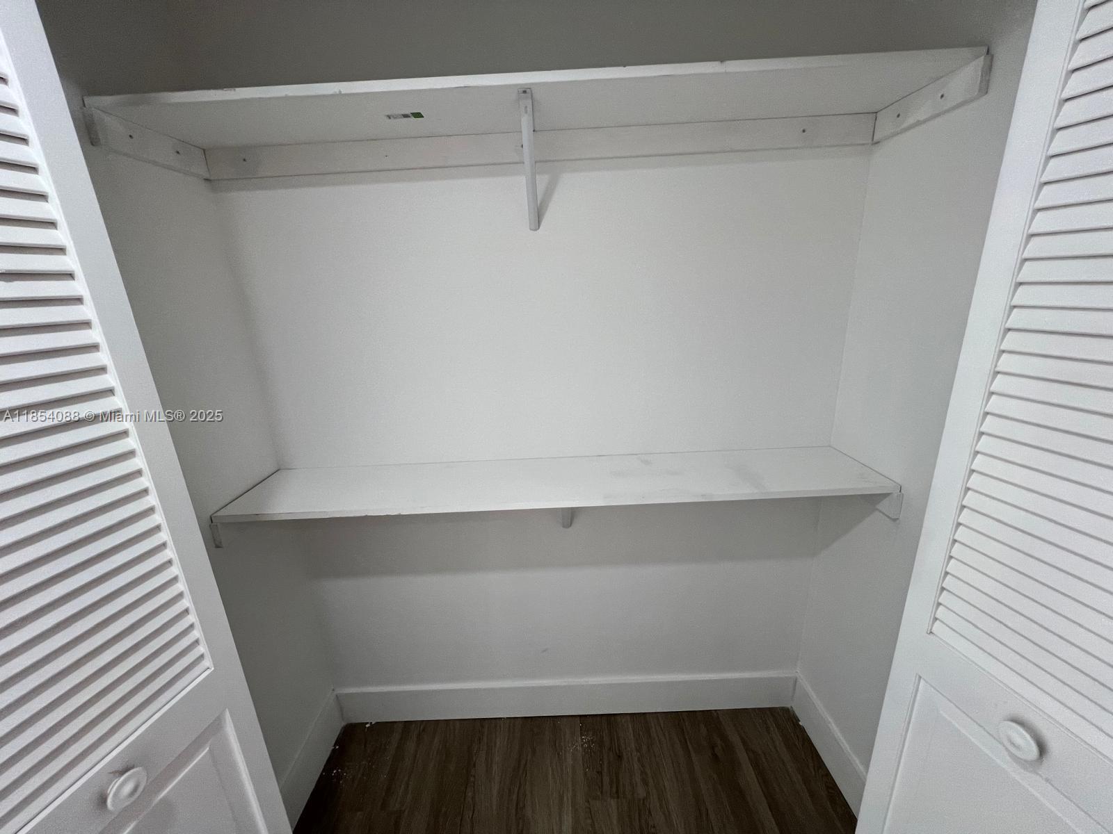 500 Bayview Drive, Unit 1120 Sunny Isles Beach, FL 33160 - Photo 38 of 46 a view of storage and utility room with wooden floor