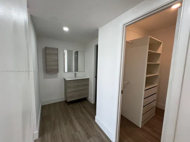 a bathroom with a sink and mirror