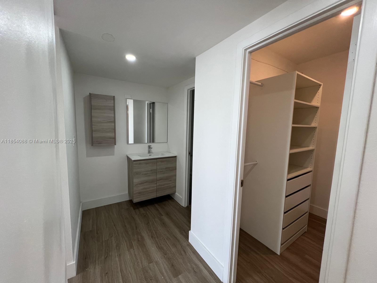 500 Bayview Drive, Unit 1120 Sunny Isles Beach, FL 33160 - Photo 39 of 46 a view of hallway with stairs and wooden floor