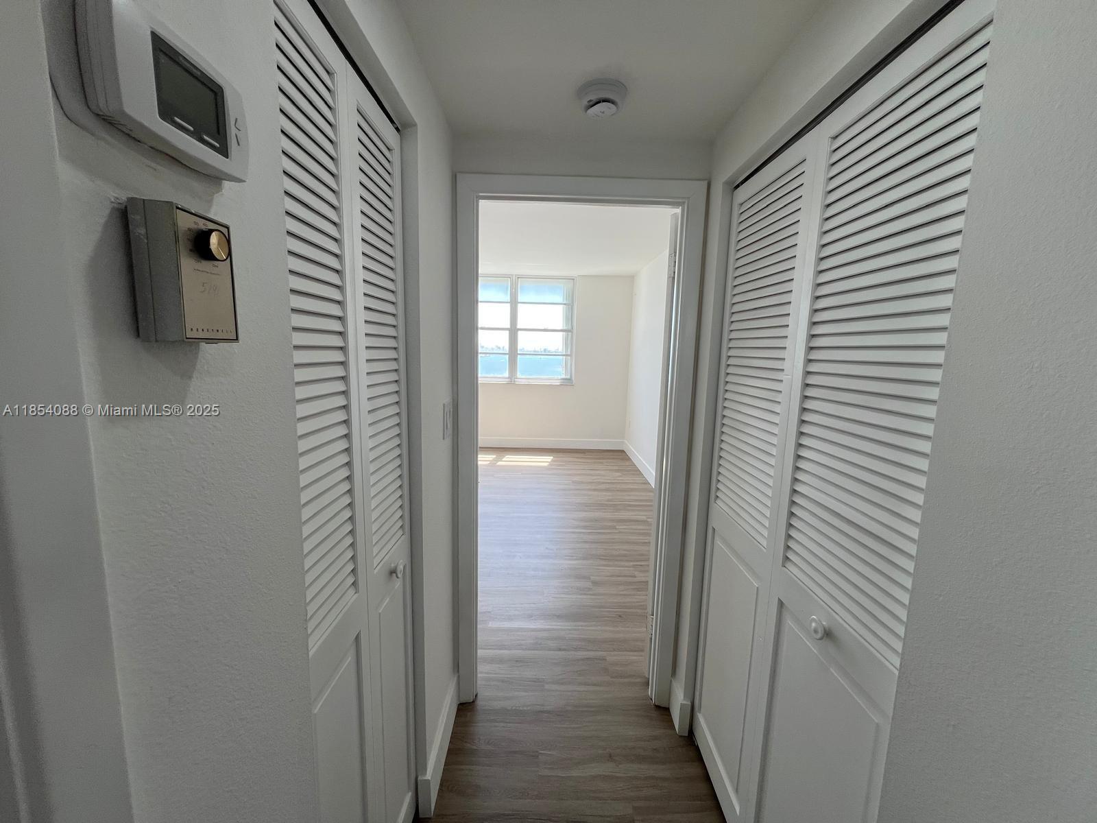 500 Bayview Drive, Unit 1120 Sunny Isles Beach, FL 33160 - Photo 43 of 46 a view of a bathroom from the hallway
