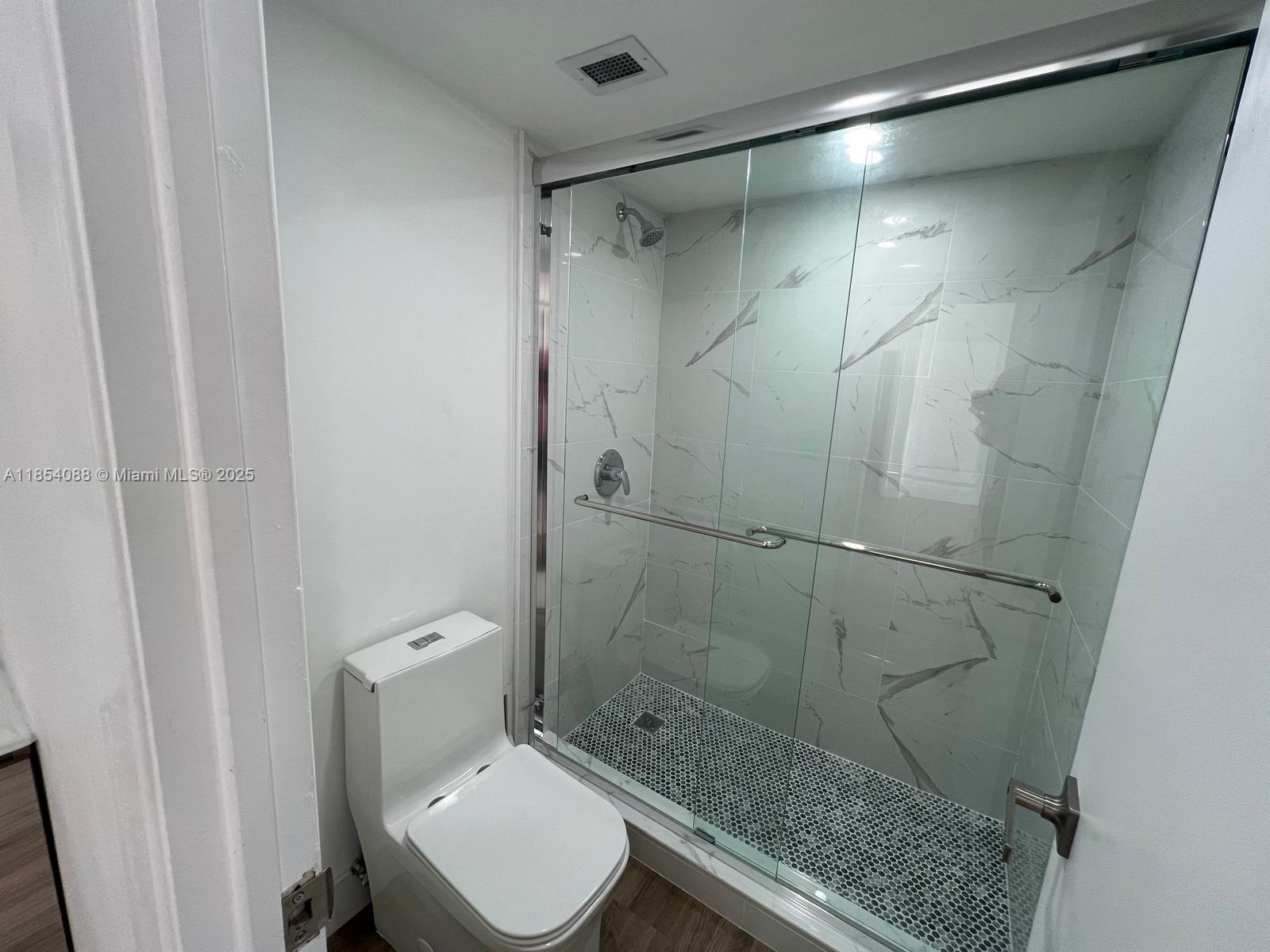 500 Bayview Drive, Unit 1120 Sunny Isles Beach, FL 33160 - Photo 46 of 46 a bathroom with a shower and a toilet
