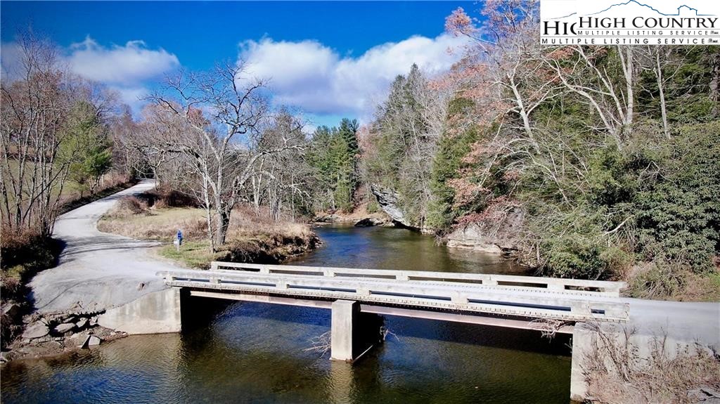 Riverside Drive Boone, NC 28607 - Photo 4 of 17 a view of balcony with wooden floor and outdoor seating