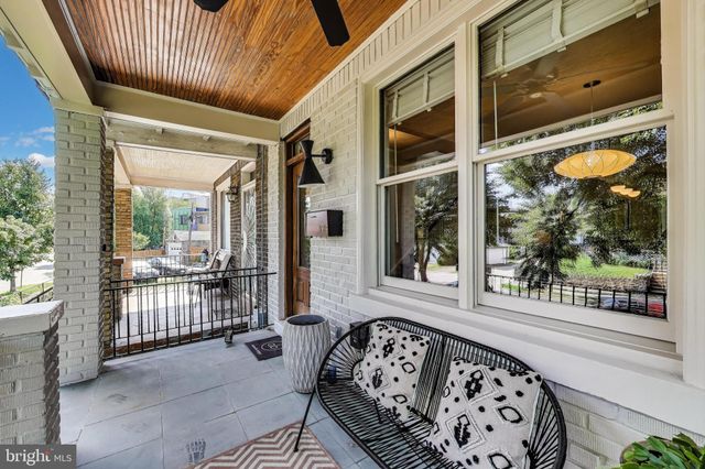 a front view of a house with a large window
