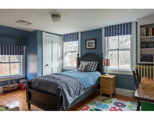 7 Labor In Vain Road Ipswich, MA 01938 - Photo 14 of 30 a bedroom with a bed window and a dresser