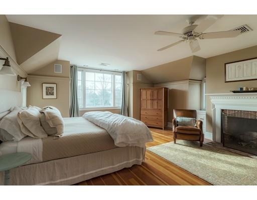 7 Labor In Vain Road Ipswich, MA 01938 - Photo 17 of 30 a bedroom with a bed and a fireplace
