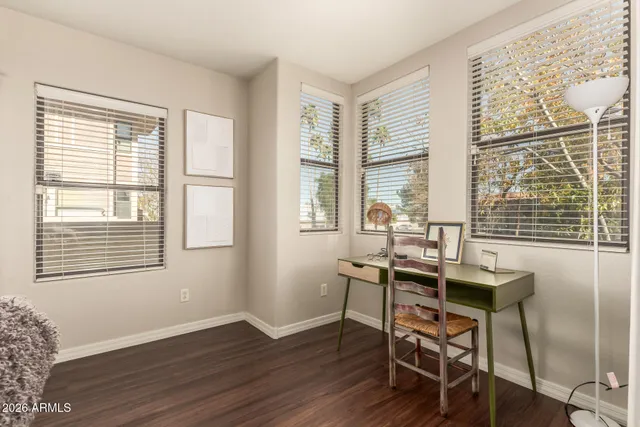 a bedroom with a bed and a potted plant