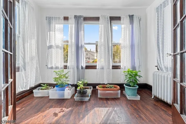a room with wooden floor and furniture