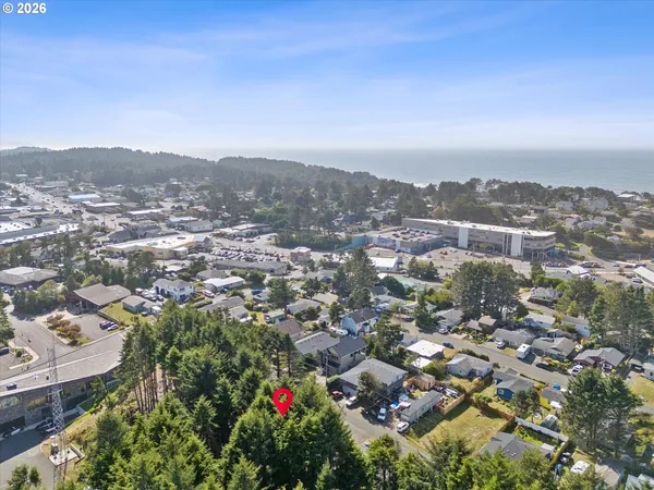 an aerial view of residential building and trees around