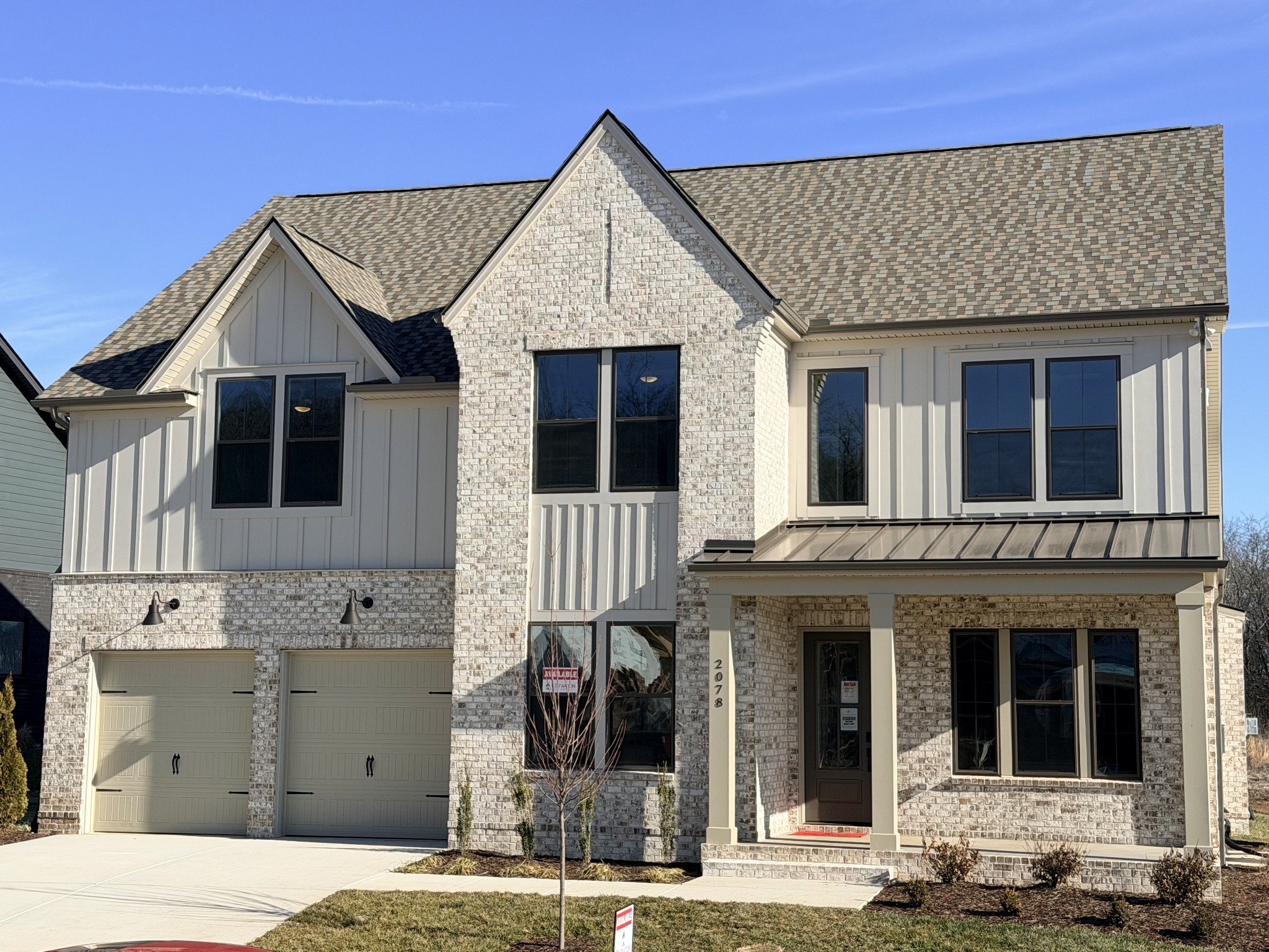 a front view of a house with glass windows