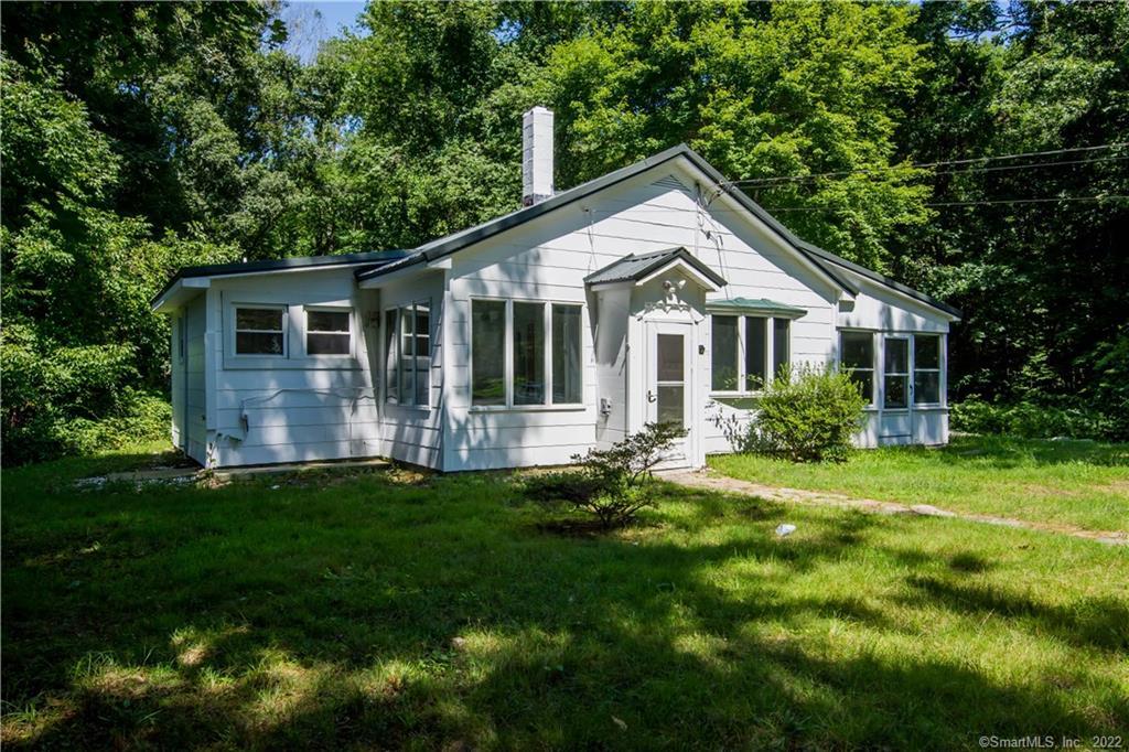 22 Scott Road East Lyme, CT 06333 - Photo 1 of 1 a front view of house with yard and green space