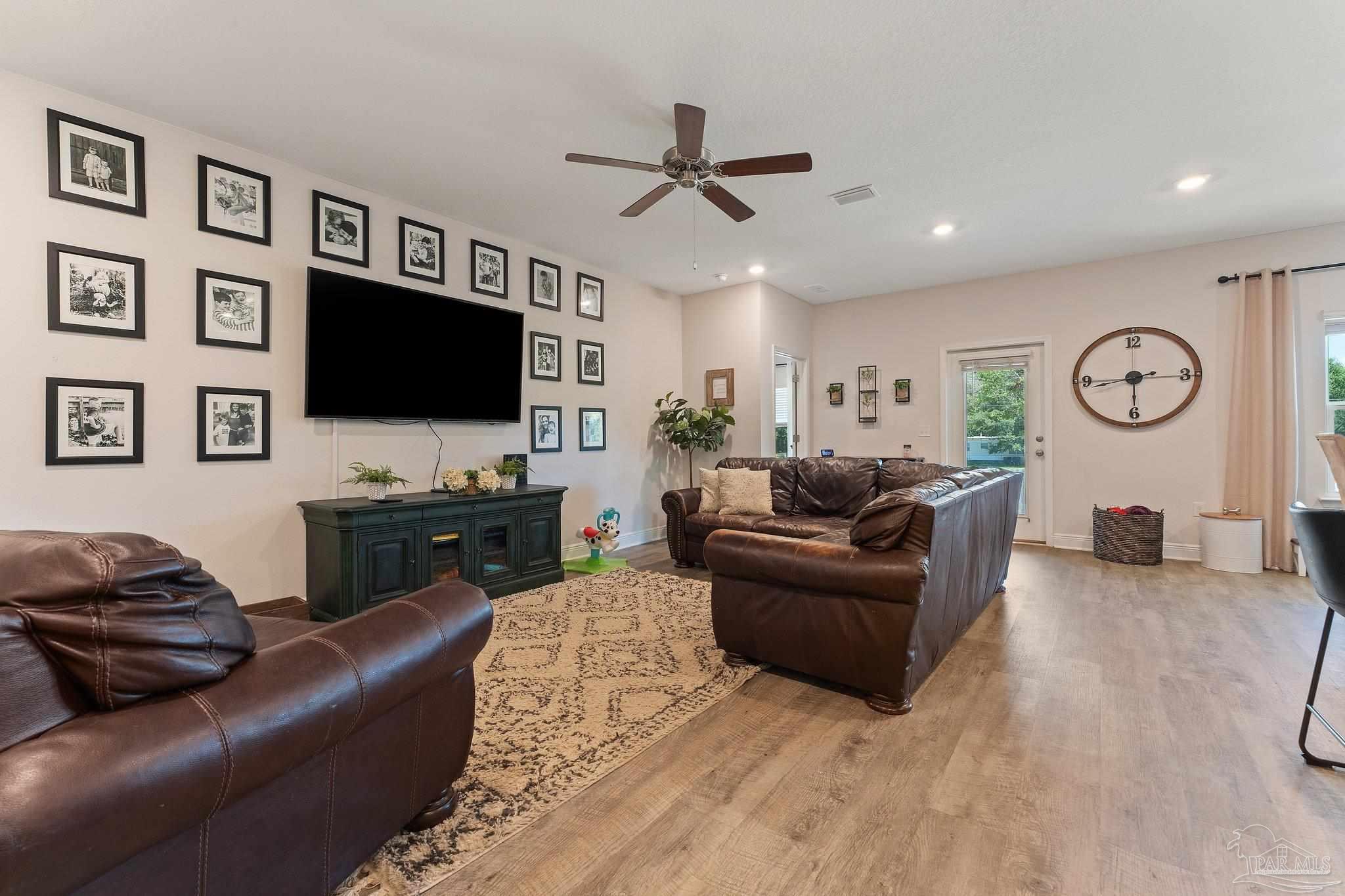8038 Burnside Loop Pensacola, FL 32526 - Photo 15 of 44 a living room with furniture and a flat screen tv