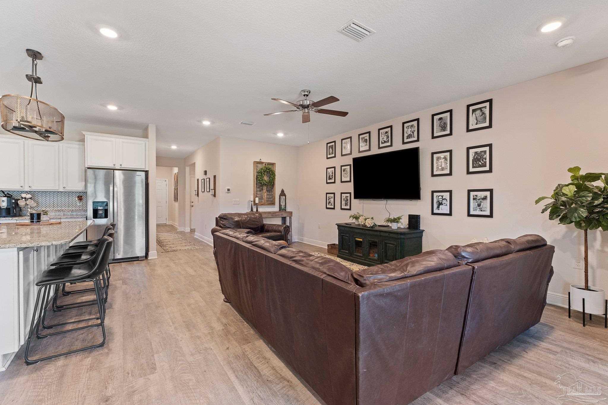 8038 Burnside Loop Pensacola, FL 32526 - Photo 17 of 44 a living room with furniture and a flat screen tv