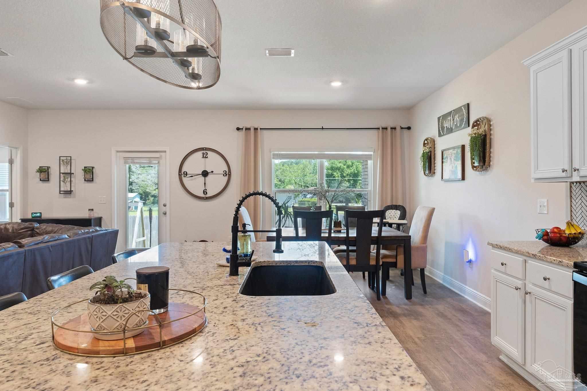 8038 Burnside Loop Pensacola, FL 32526 - Photo 22 of 44 a living room with fireplace furniture and a window