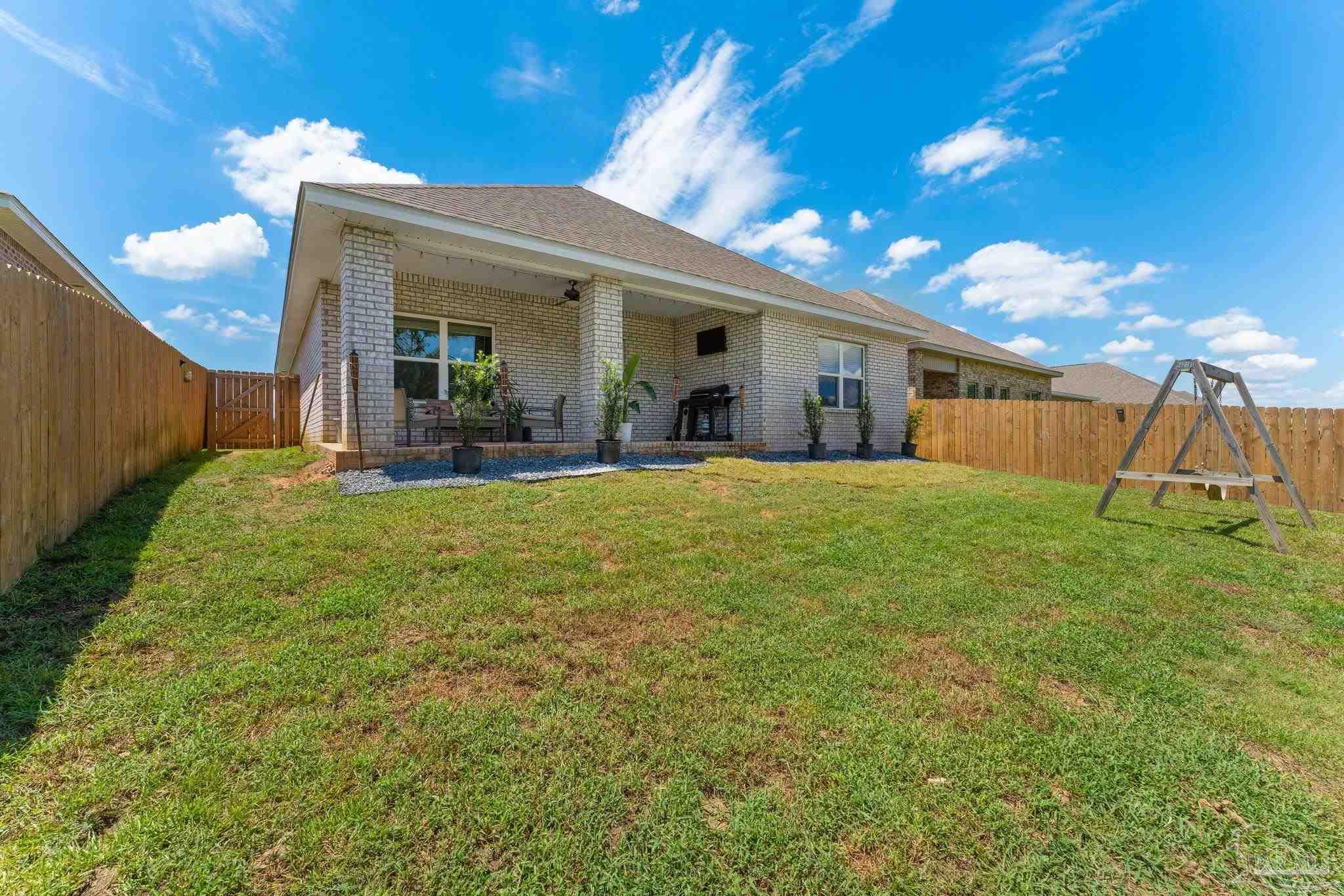 8038 Burnside Loop Pensacola, FL 32526 - Photo 31 of 44 a view of a house with a yard and porch