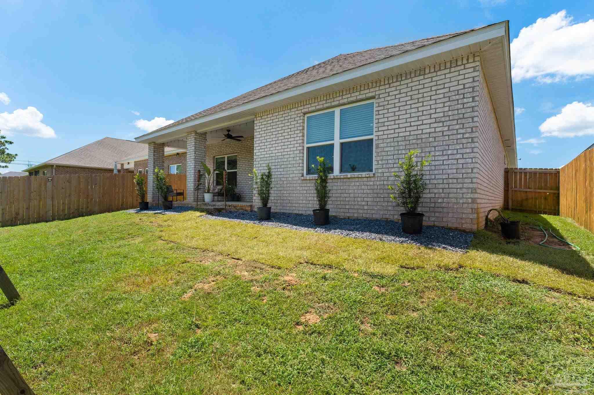 8038 Burnside Loop Pensacola, FL 32526 - Photo 32 of 44 a front view of a house with a yard