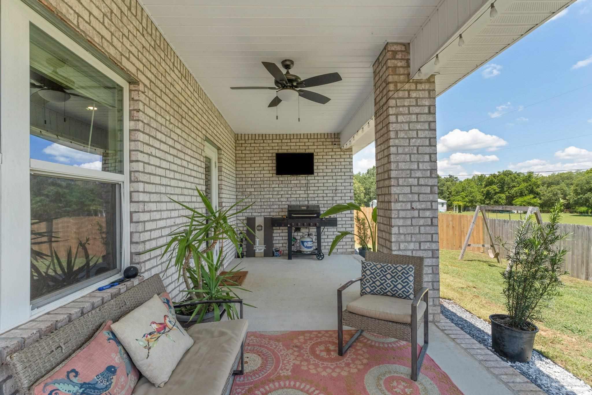 8038 Burnside Loop Pensacola, FL 32526 - Photo 33 of 44 a building outdoor space with patio furniture