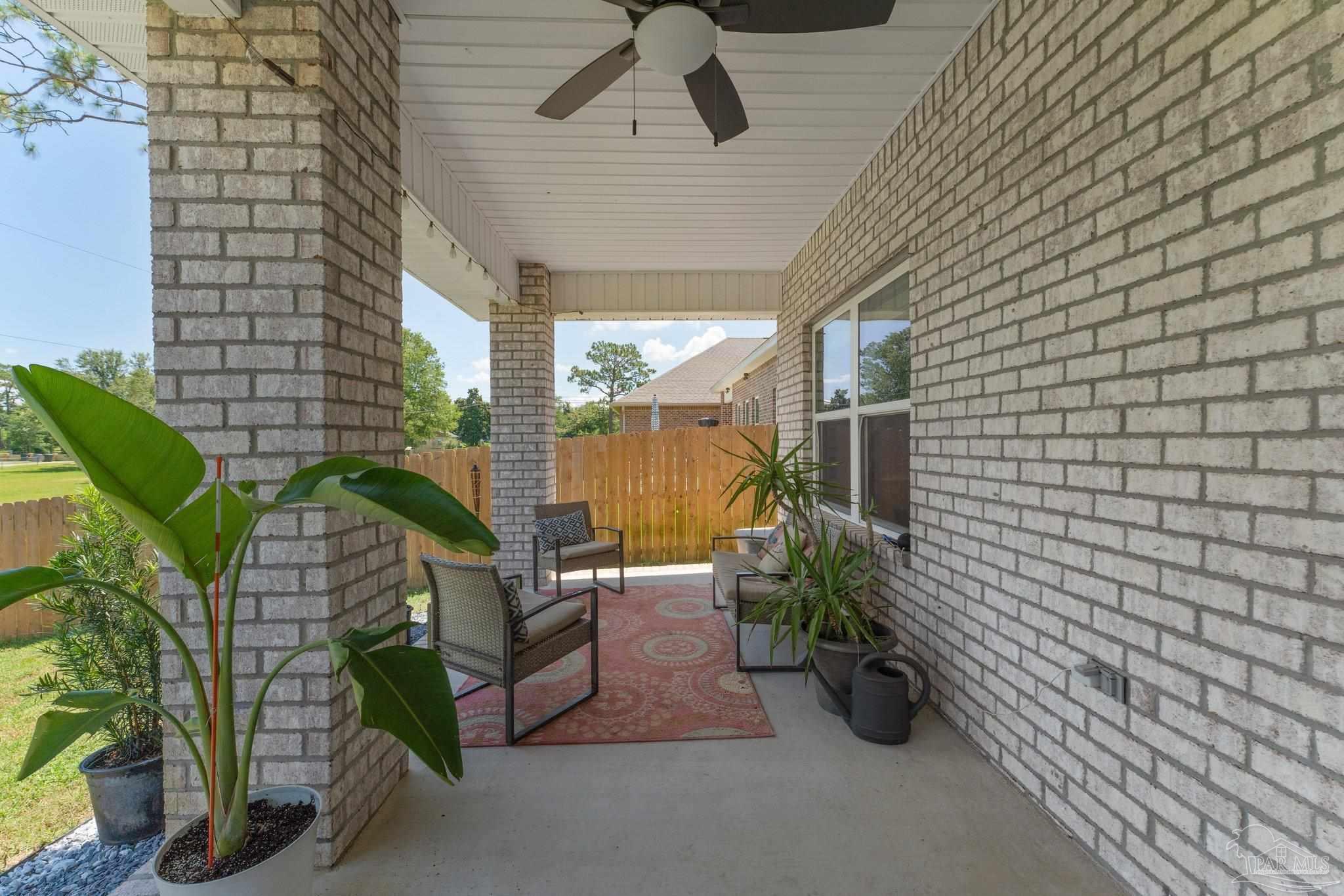 8038 Burnside Loop Pensacola, FL 32526 - Photo 34 of 44 a view of potted plants in front of a house