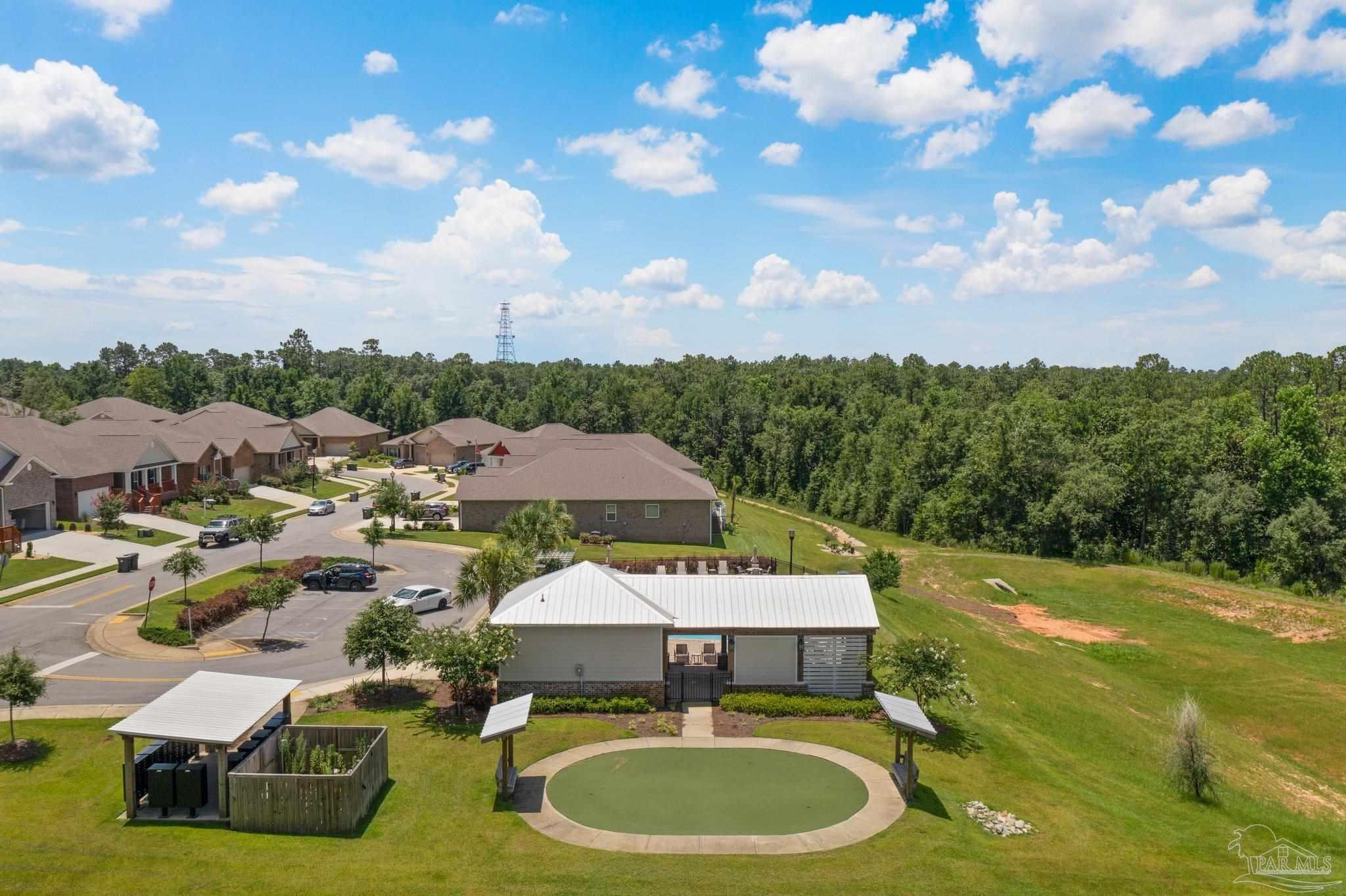 8038 Burnside Loop Pensacola, FL 32526 - Photo 43 of 44 a swimming pool with outdoor seating and yard
