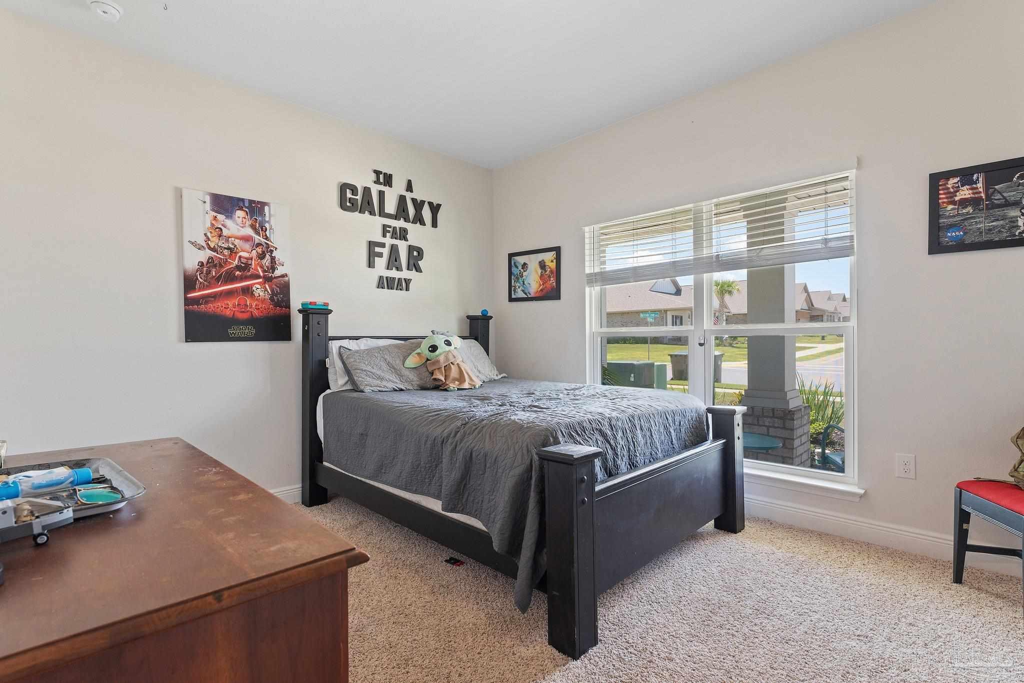 8038 Burnside Loop Pensacola, FL 32526 - Photo 7 of 44 a bedroom with a bed and a window