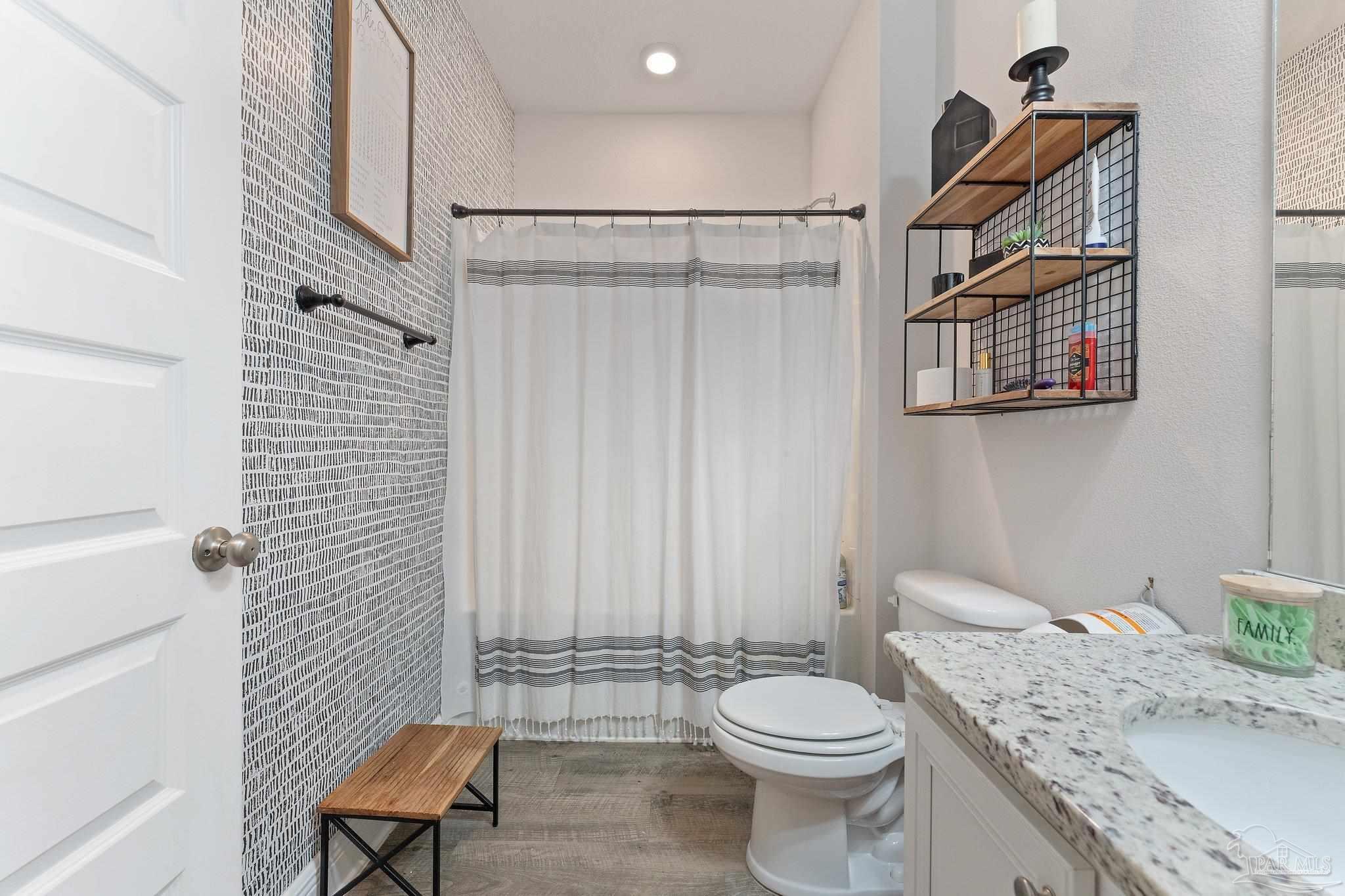 8038 Burnside Loop Pensacola, FL 32526 - Photo 9 of 44 a bathroom with a granite countertop toilet and a sink