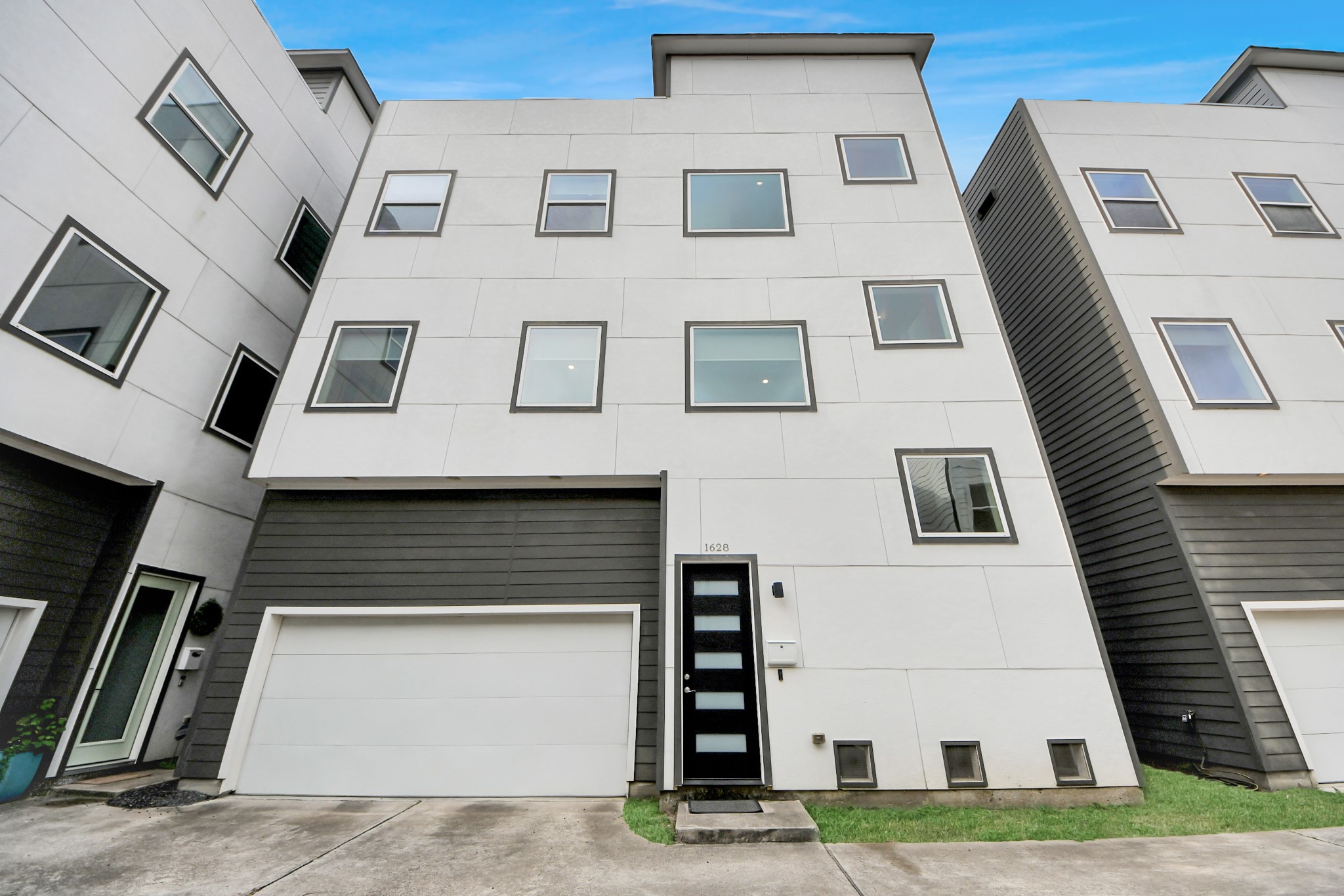 1628 West 24th Street Houston, TX 77008 - Photo 2 of 41 Discover modern elegance with this striking home, featuring a sleek contemporary front door installed in 2025, perfectly blending style and sophistication.