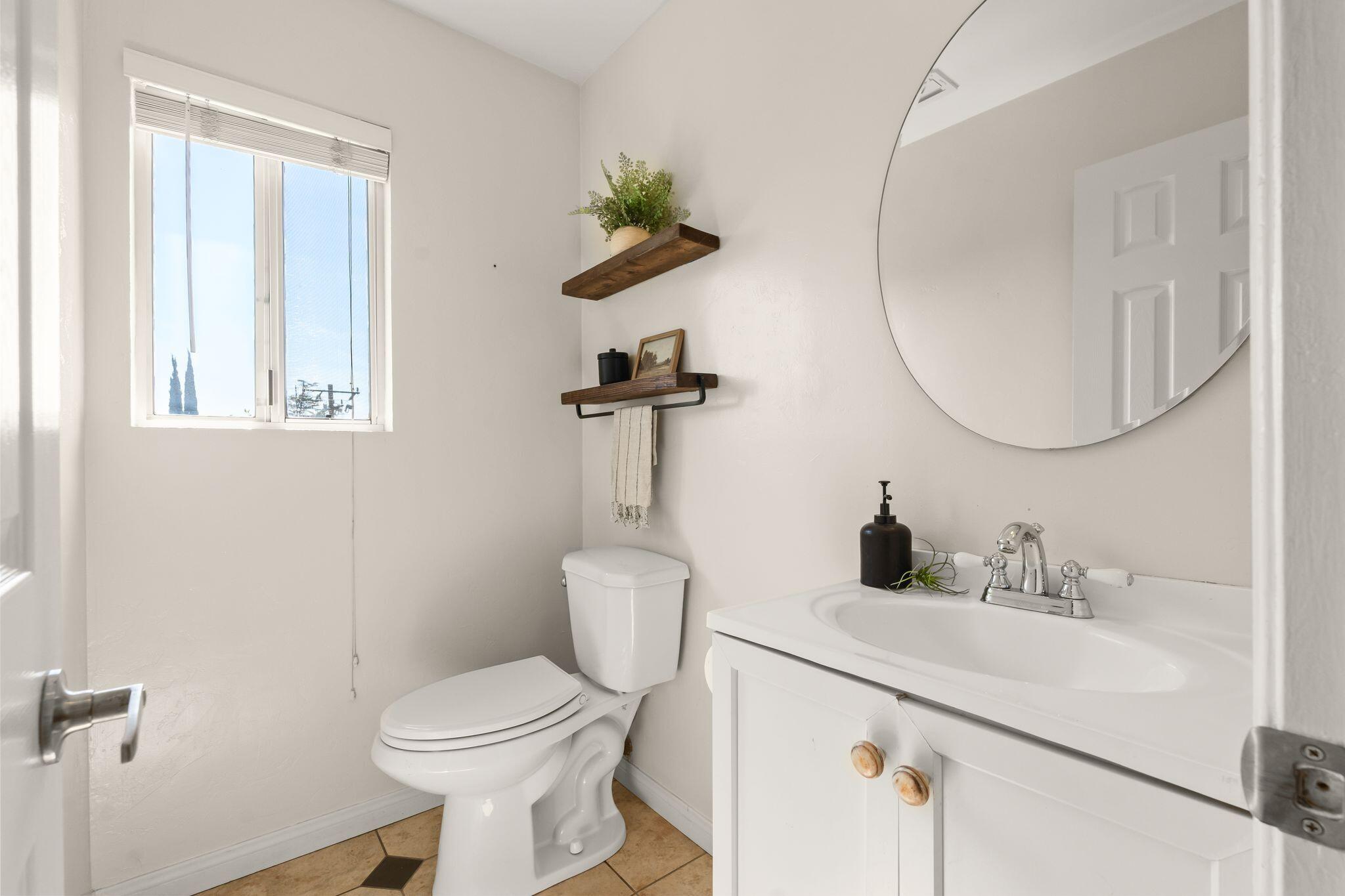 1000 Foothill Drive Fillmore, CA 93015 - Photo 24 of 86 a bathroom with a toilet sink and mirror