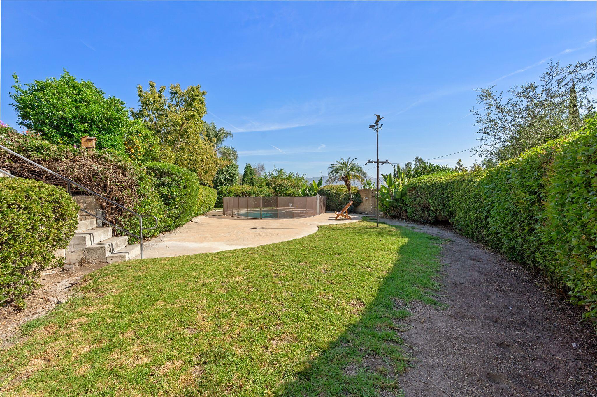 1000 Foothill Drive Fillmore, CA 93015 - Photo 61 of 86 a view of a garden with a tree in the background