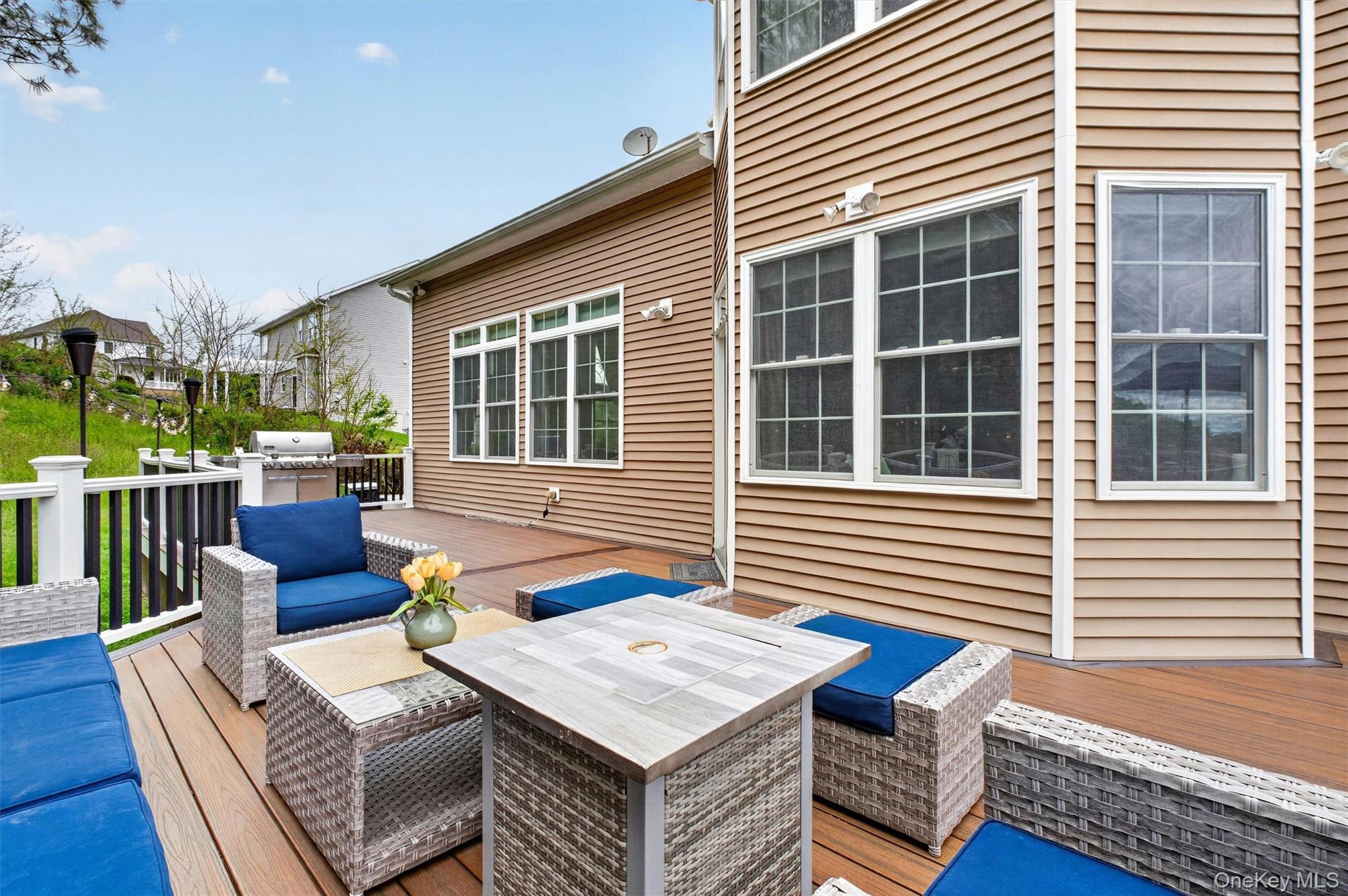219 Country Club Road Hopewell Junction, NY 12533 - Photo 46 of 49 a view of a deck with couches floor to ceiling window and wooden floor