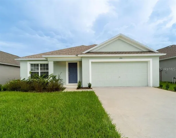 a kitchen with stainless steel appliances granite countertop a stove a sink a refrigerator and a oven