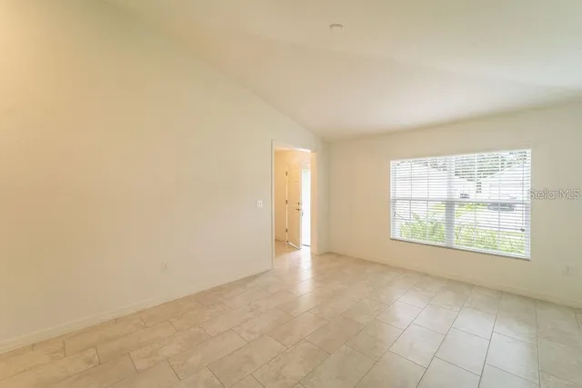 a kitchen with kitchen island a refrigerator stove and sink