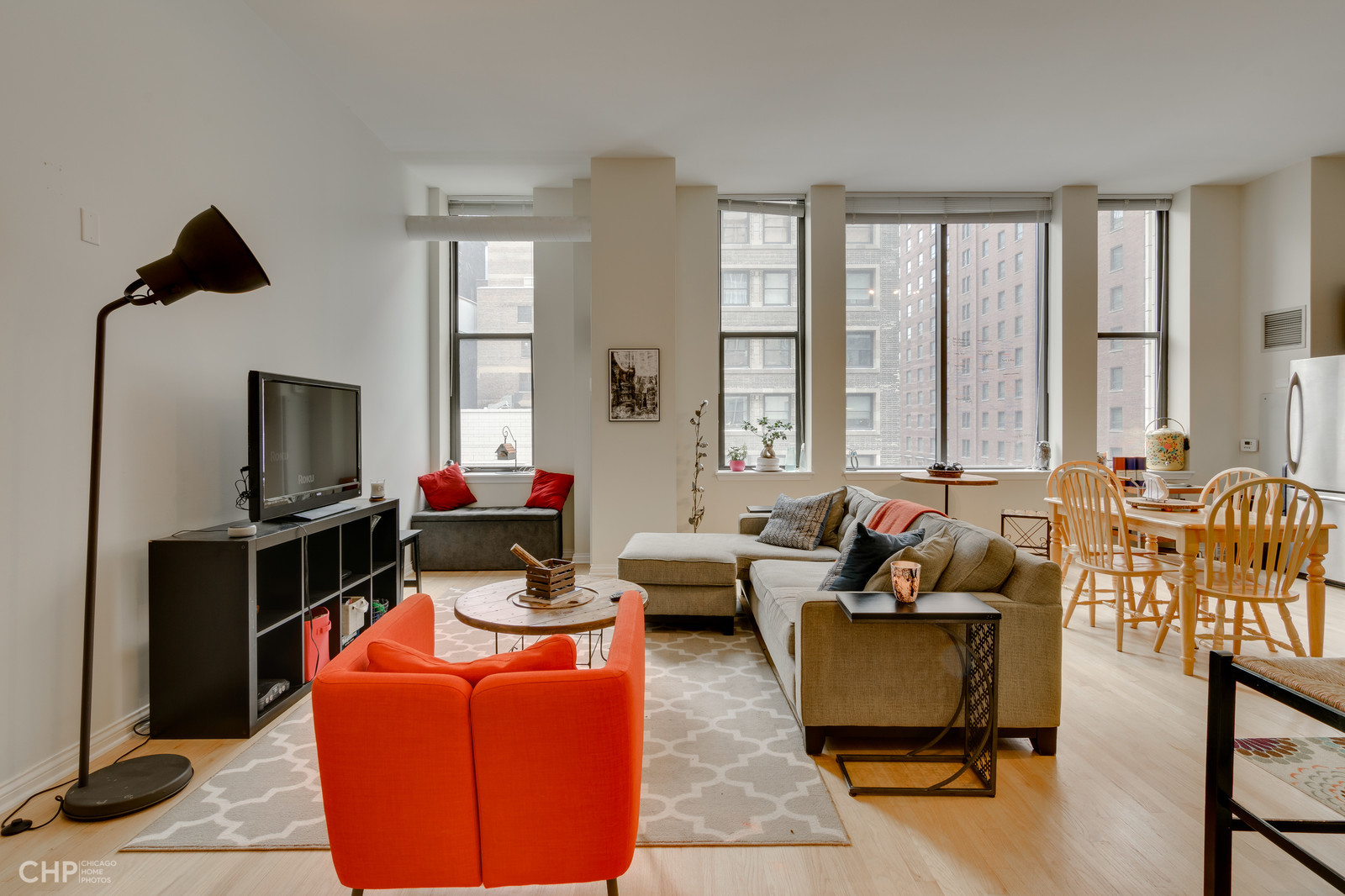 8 West Monroe Street, Unit 905 Chicago, IL 60603 - Photo 7 of 17 a living room with furniture windows and a flat screen tv