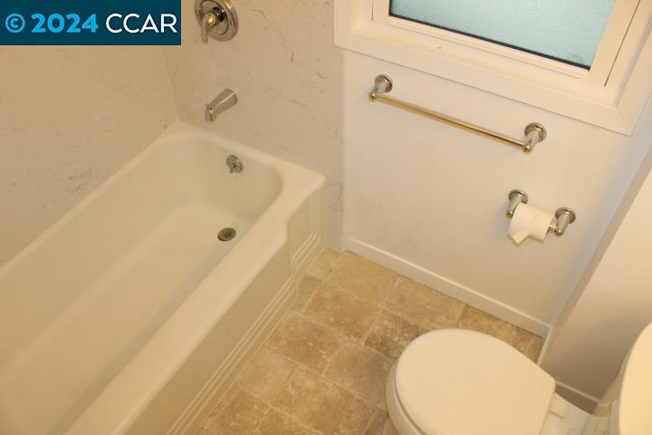 908 Everett Street El Cerrito, CA 94530 - Photo 15 of 27 a bathroom with a tub