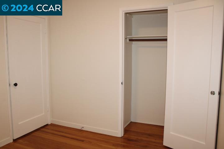 908 Everett Street El Cerrito, CA 94530 - Photo 17 of 27 a view of empty room with wooden floor