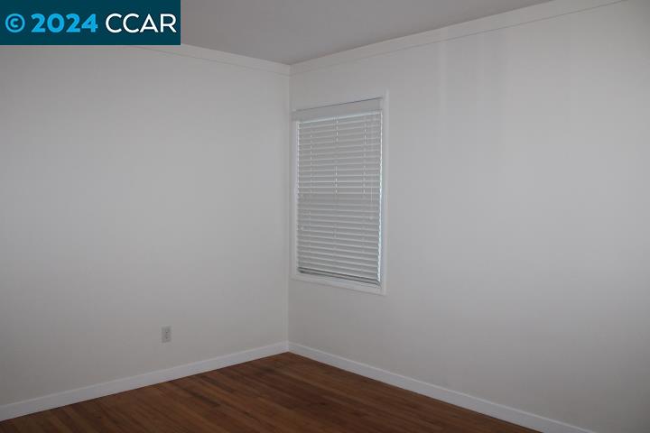 908 Everett Street El Cerrito, CA 94530 - Photo 21 of 27 a view of a small space with wooden floor and a window