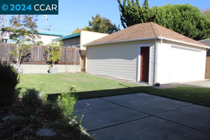 908 Everett Street El Cerrito, CA 94530 - Photo 22 of 27 a view of a white house with a yard and plants