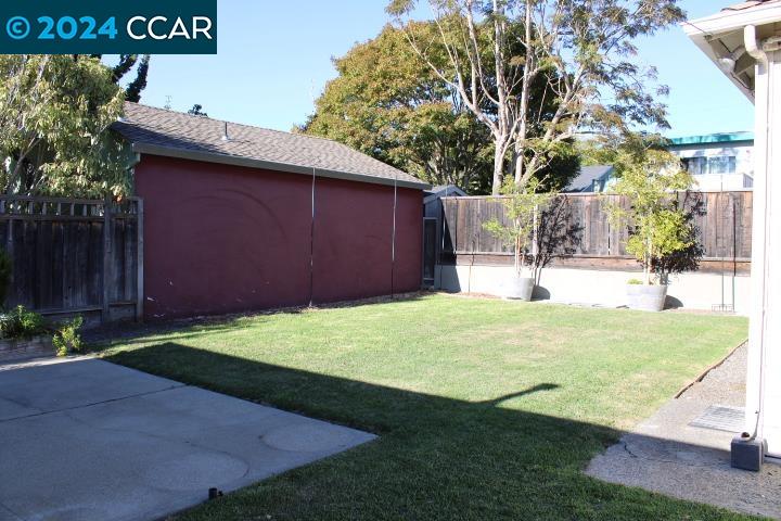 908 Everett Street El Cerrito, CA 94530 - Photo 23 of 27 a backyard of a house with yard and outdoor seating