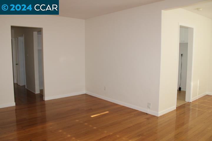 908 Everett Street El Cerrito, CA 94530 - Photo 5 of 27 a view of an empty room with wooden floor
