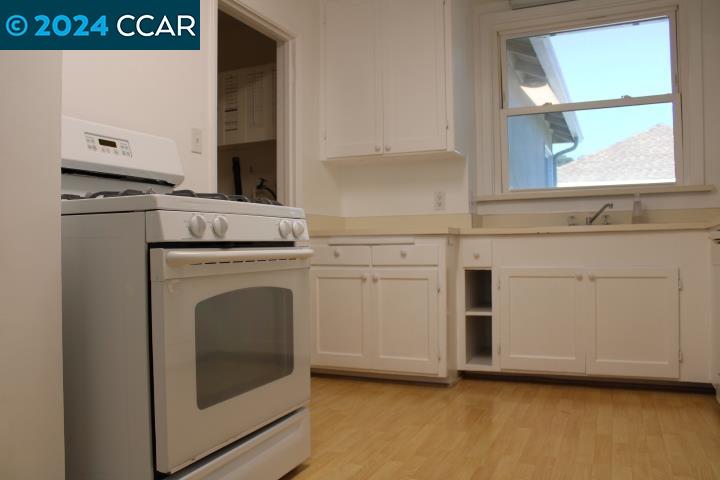 908 Everett Street El Cerrito, CA 94530 - Photo 9 of 27 a view of a kitchen with washer and dryer