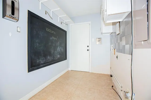 a view of a hallway to rooms