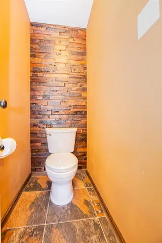 a bathroom with a toilet and a sink