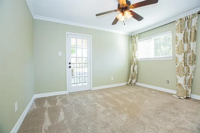 a view of an empty room with a window