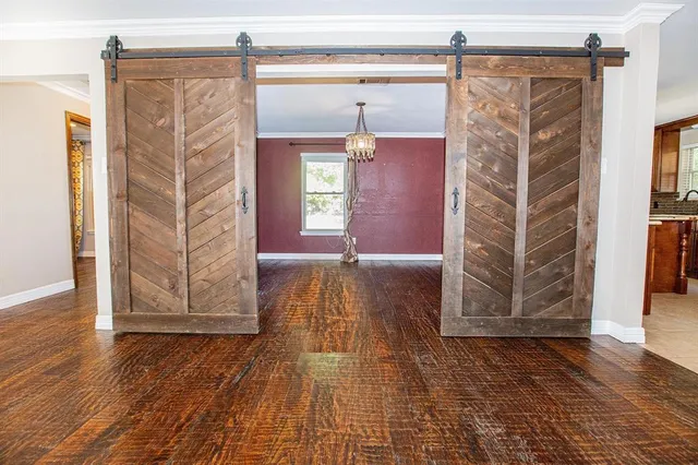 a view of a house with wooden floor and a ceiling fan