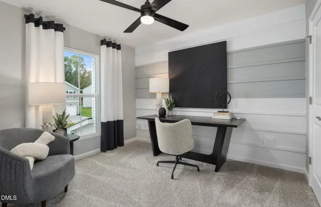 a view of a livingroom with furniture and a window