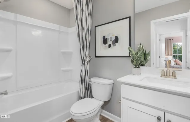 a bathroom with a toilet sink and a bathtub