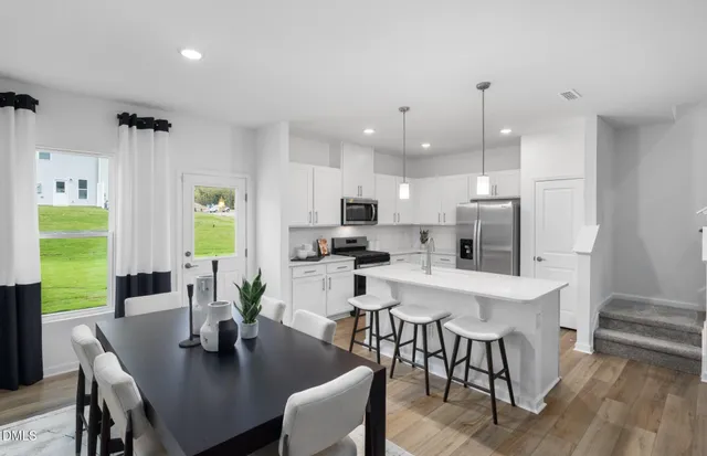a view of a dining room with furniture window and outside view