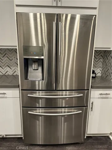 a bathroom with a shower sink and mirror