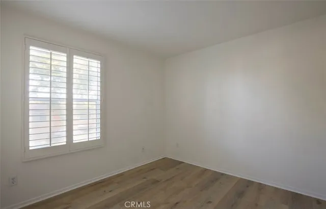 a spacious bathroom with a double vanity sink and mirror