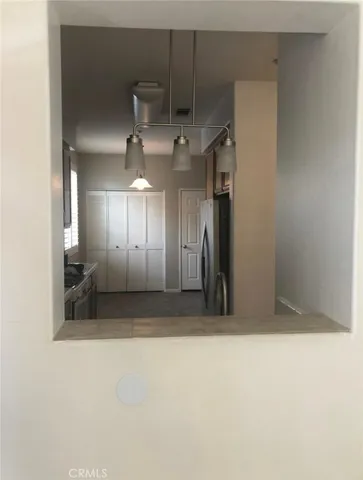 a view of an empty room with a fireplace