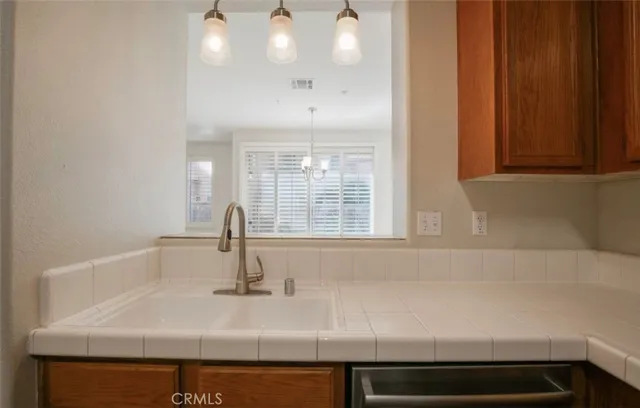 a close view of a sink and a window